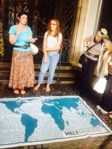 People standing in front of a map discussing aspects of globalisation
